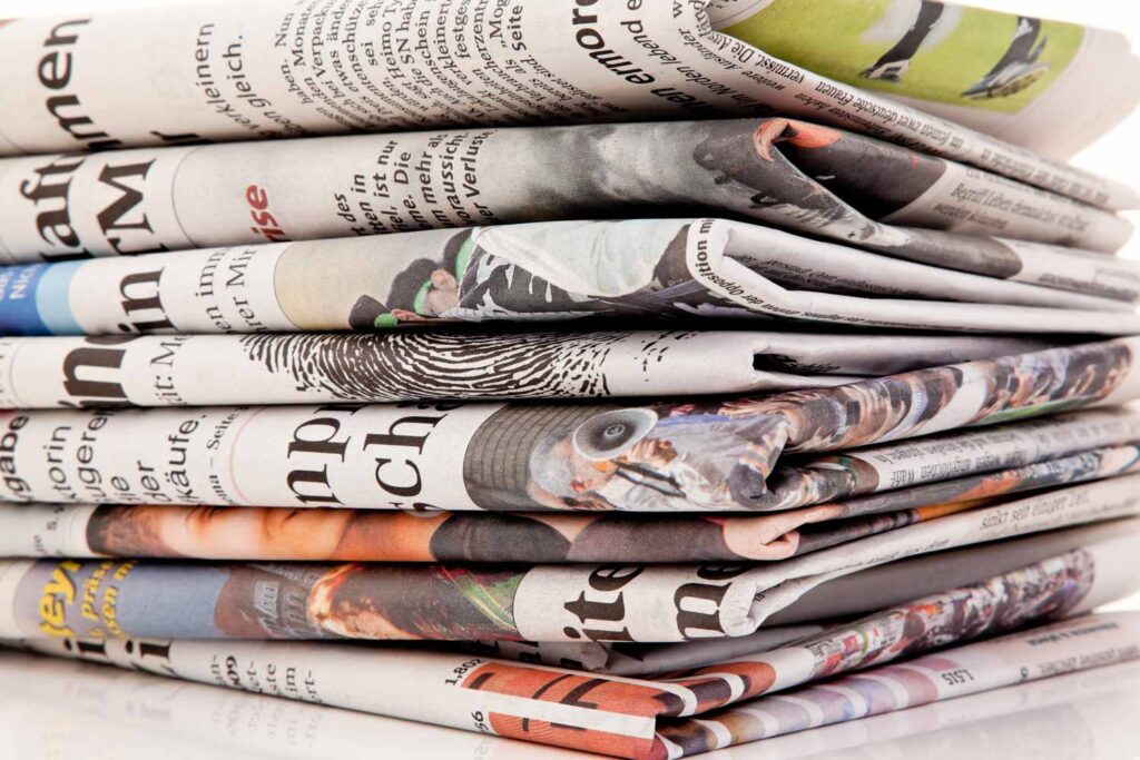 Pile of folded newspapers
